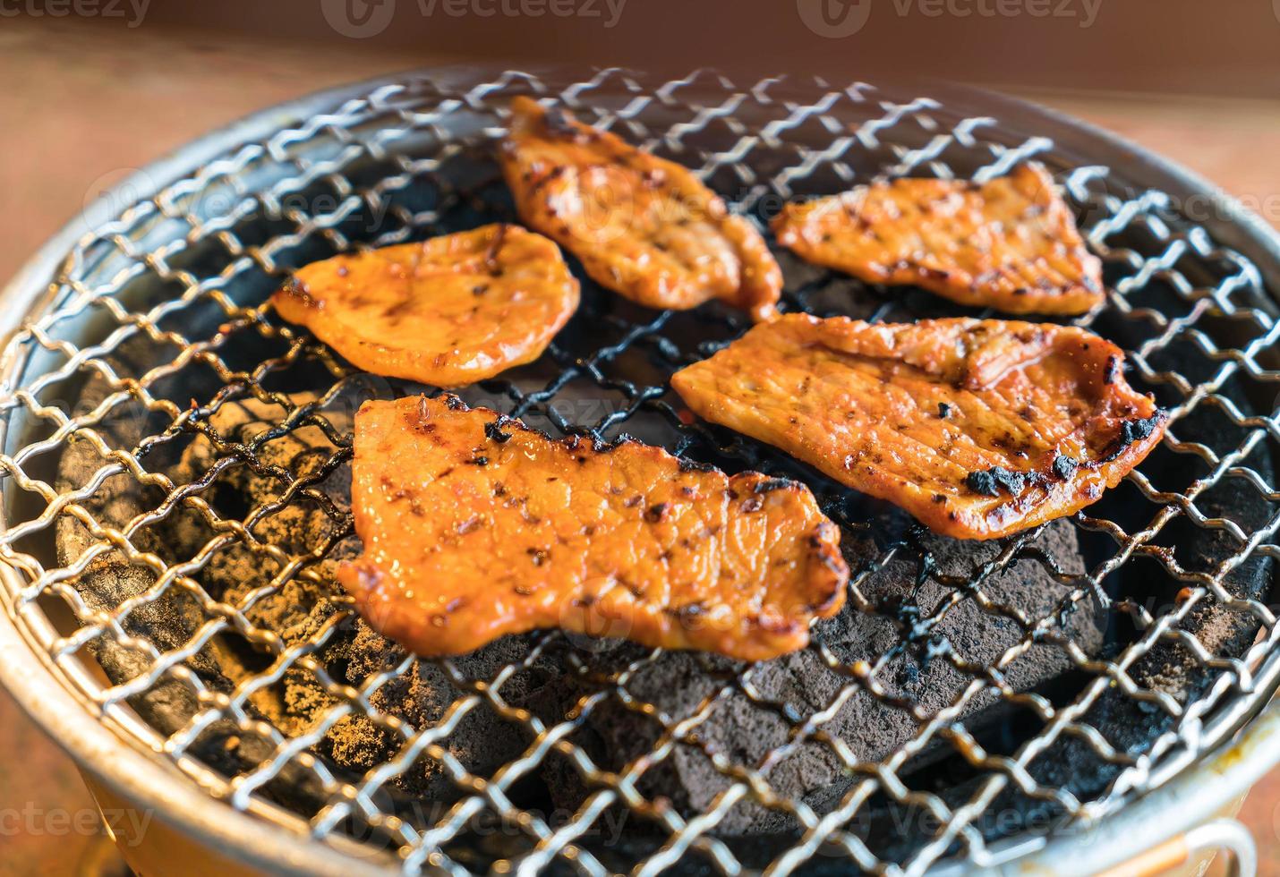 Pork on charcoal grill - Yakiniku - Korean style photo