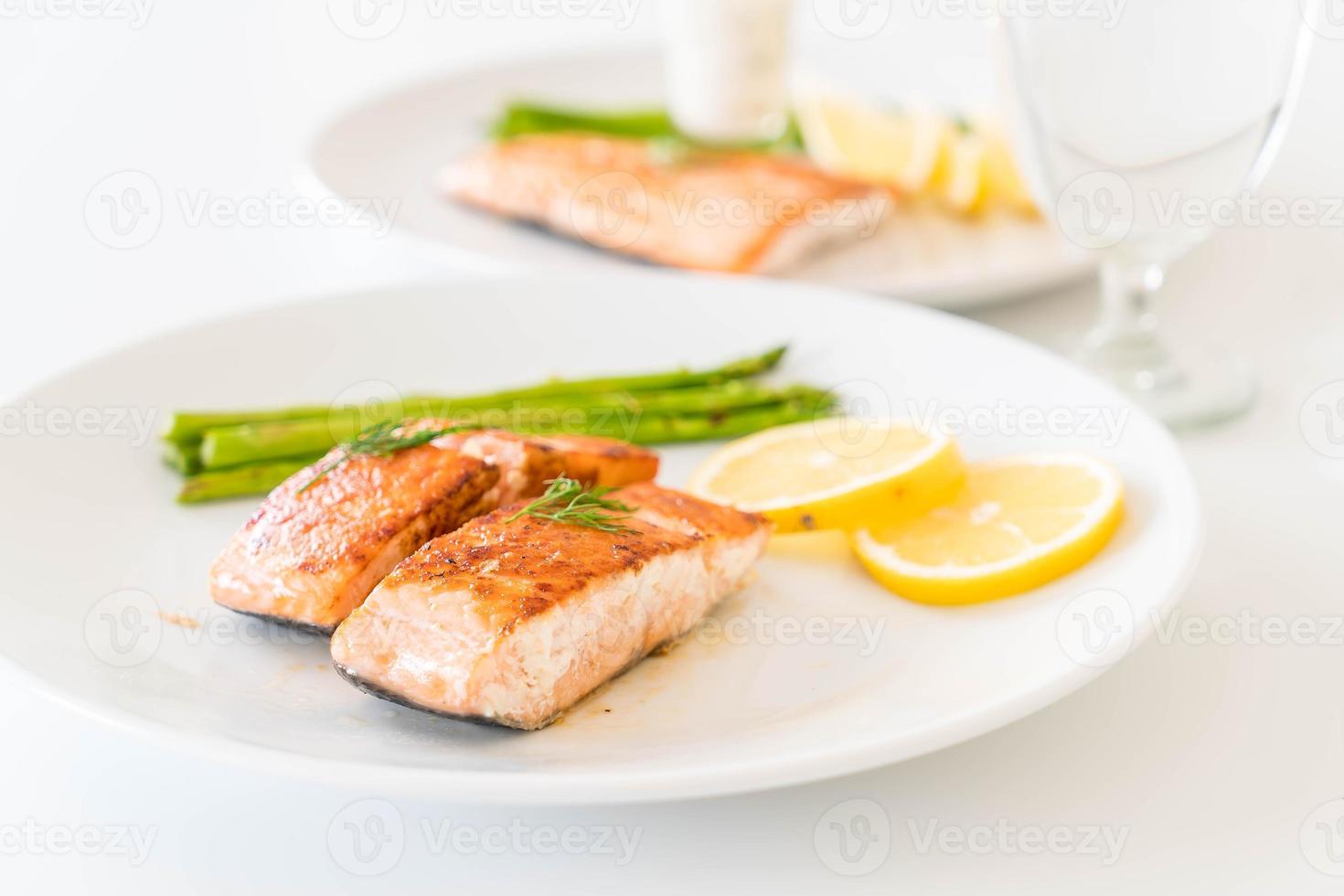Grilled salmon steak on the table photo