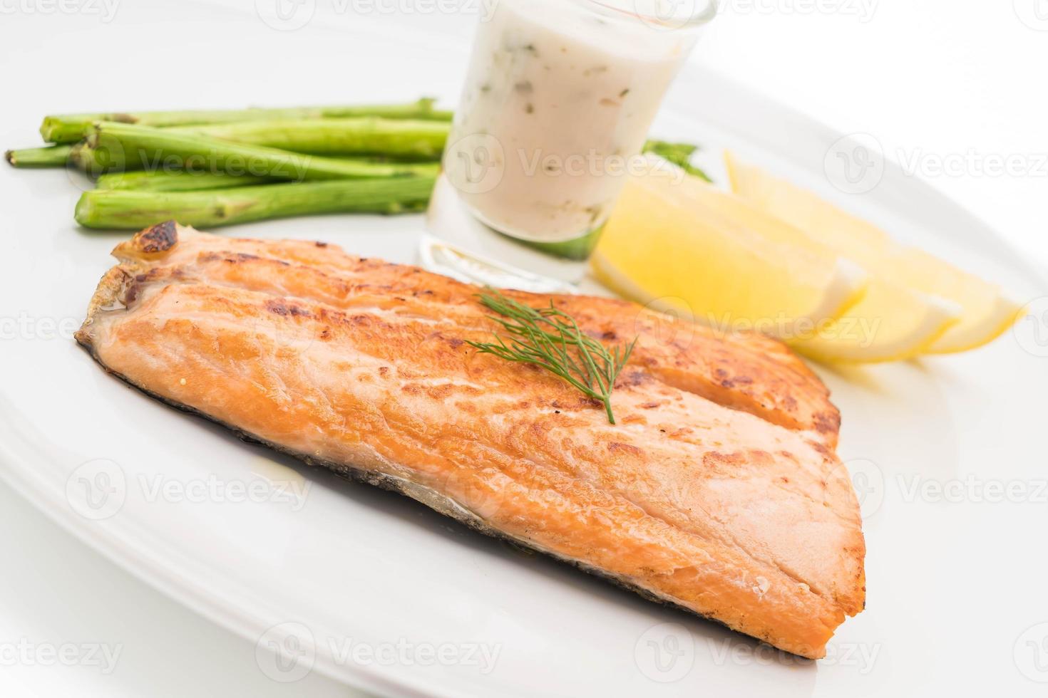 Grilled salmon steak on the table photo