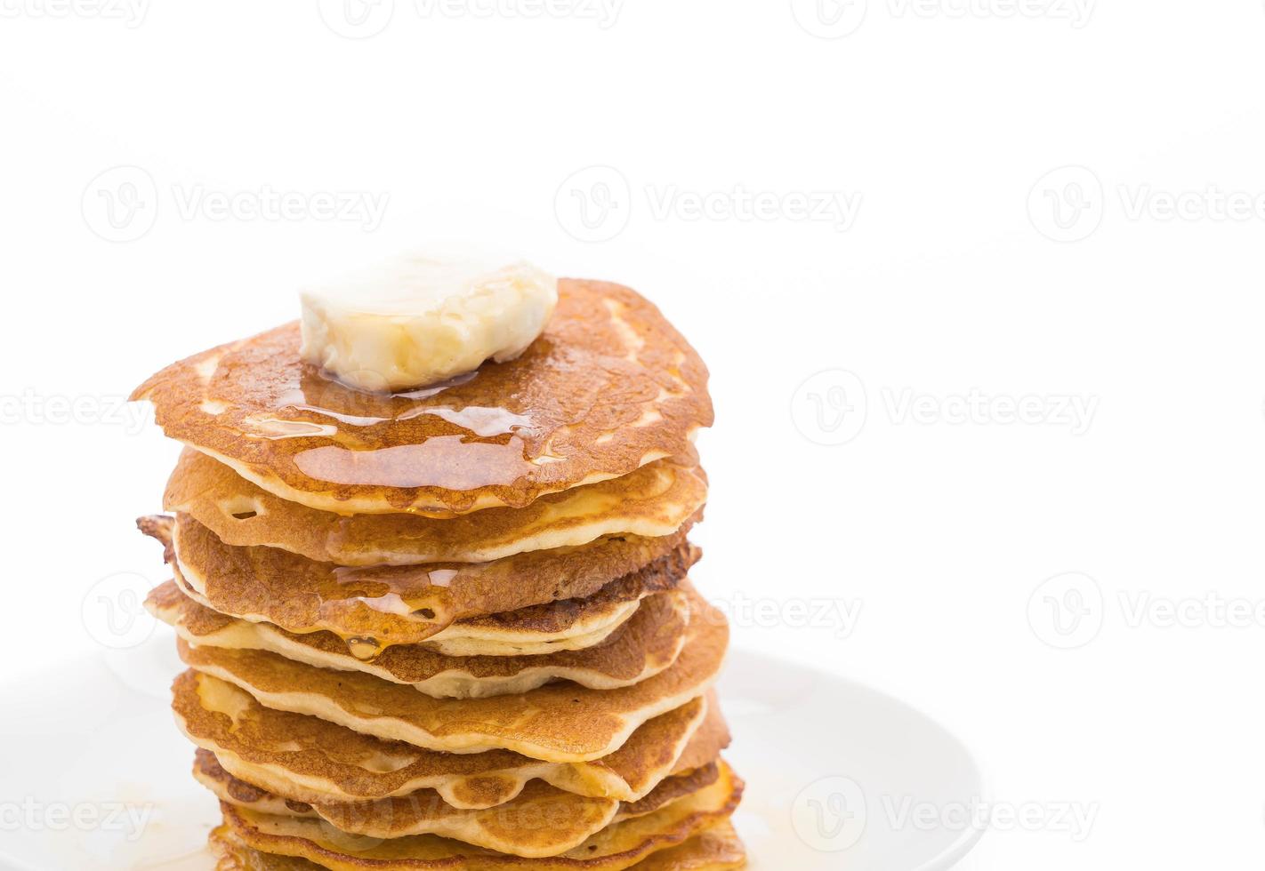 queso en pila de panqueques con miel foto