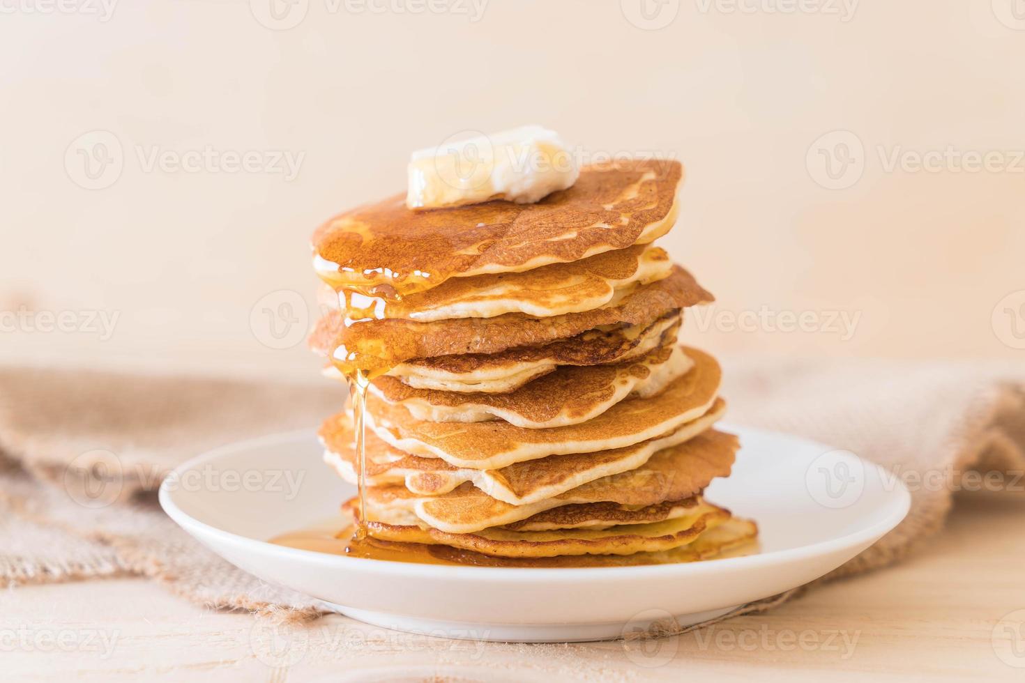 Cheese on pancake stack with honey photo