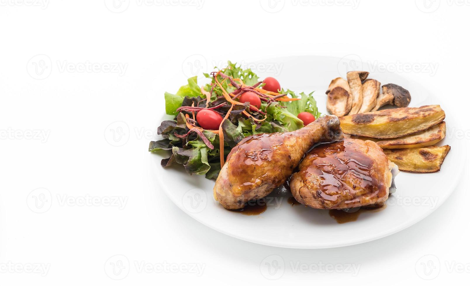 Grilled chicken steak with teriyaki sauce on dining table photo