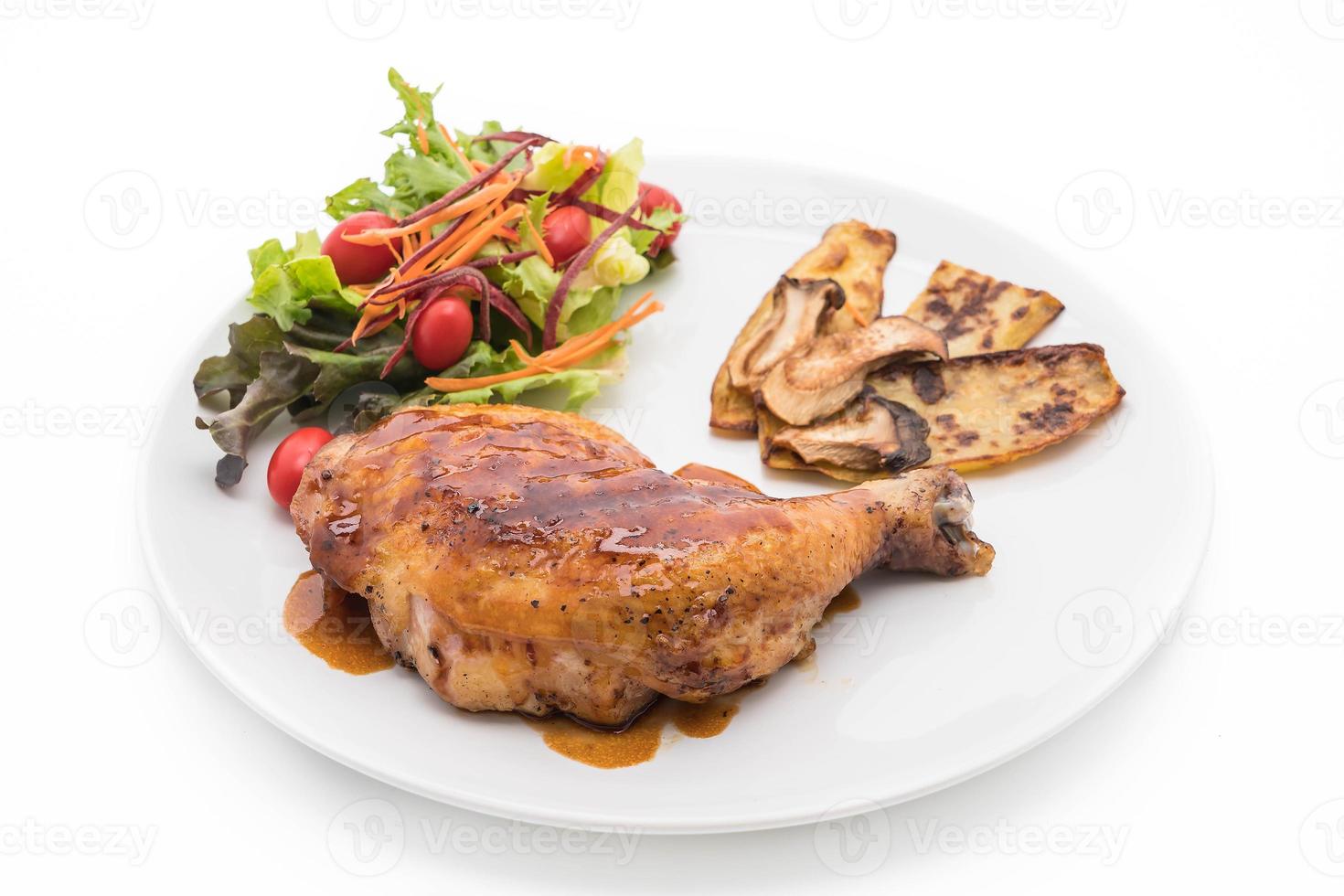Grilled chicken steak with teriyaki sauce on dining table photo