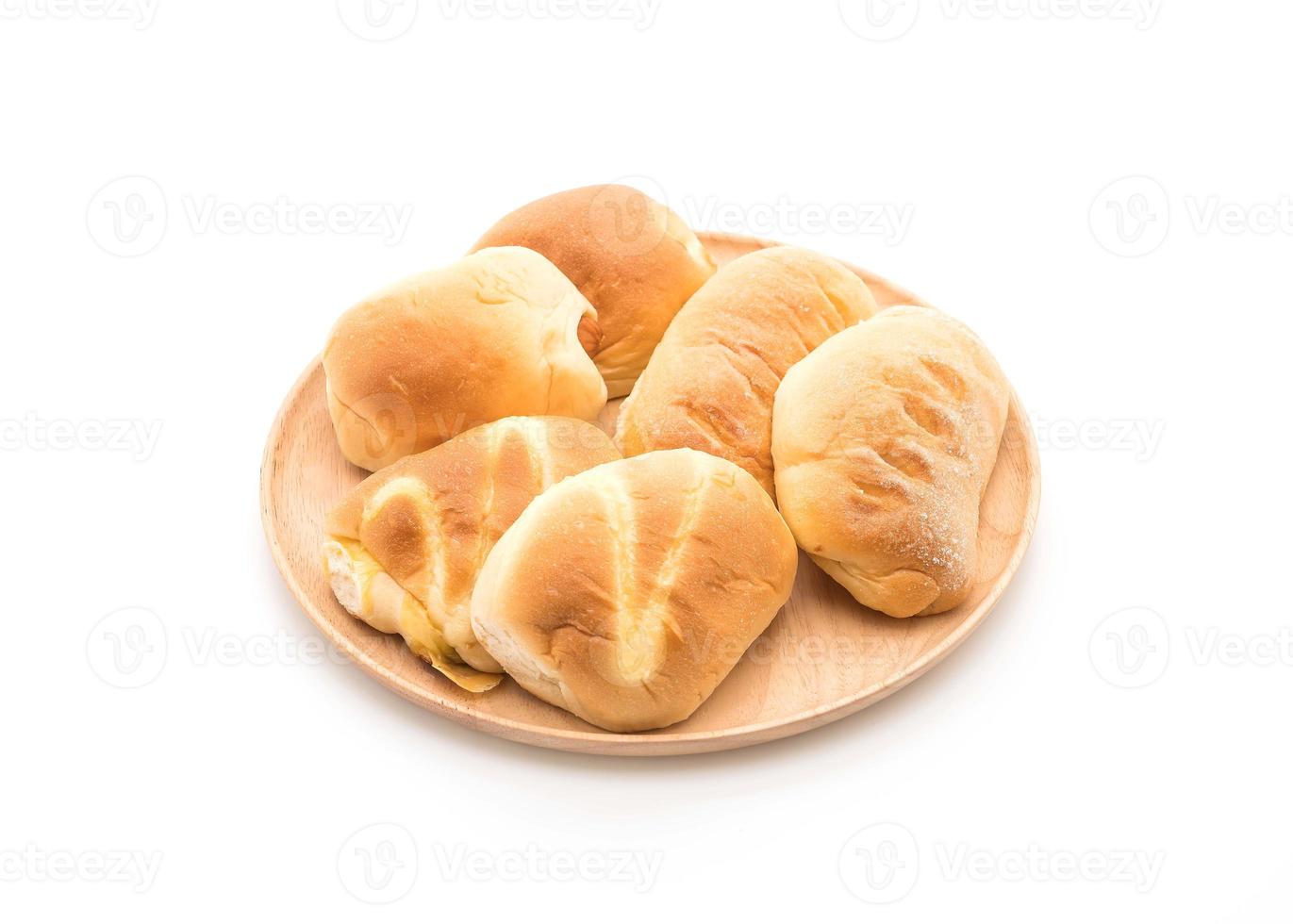 Bread in wood plate on white background photo