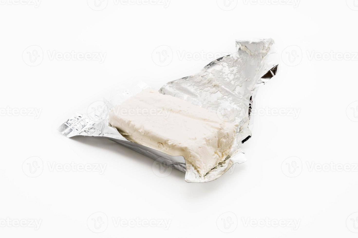 Cream cheese on white background photo