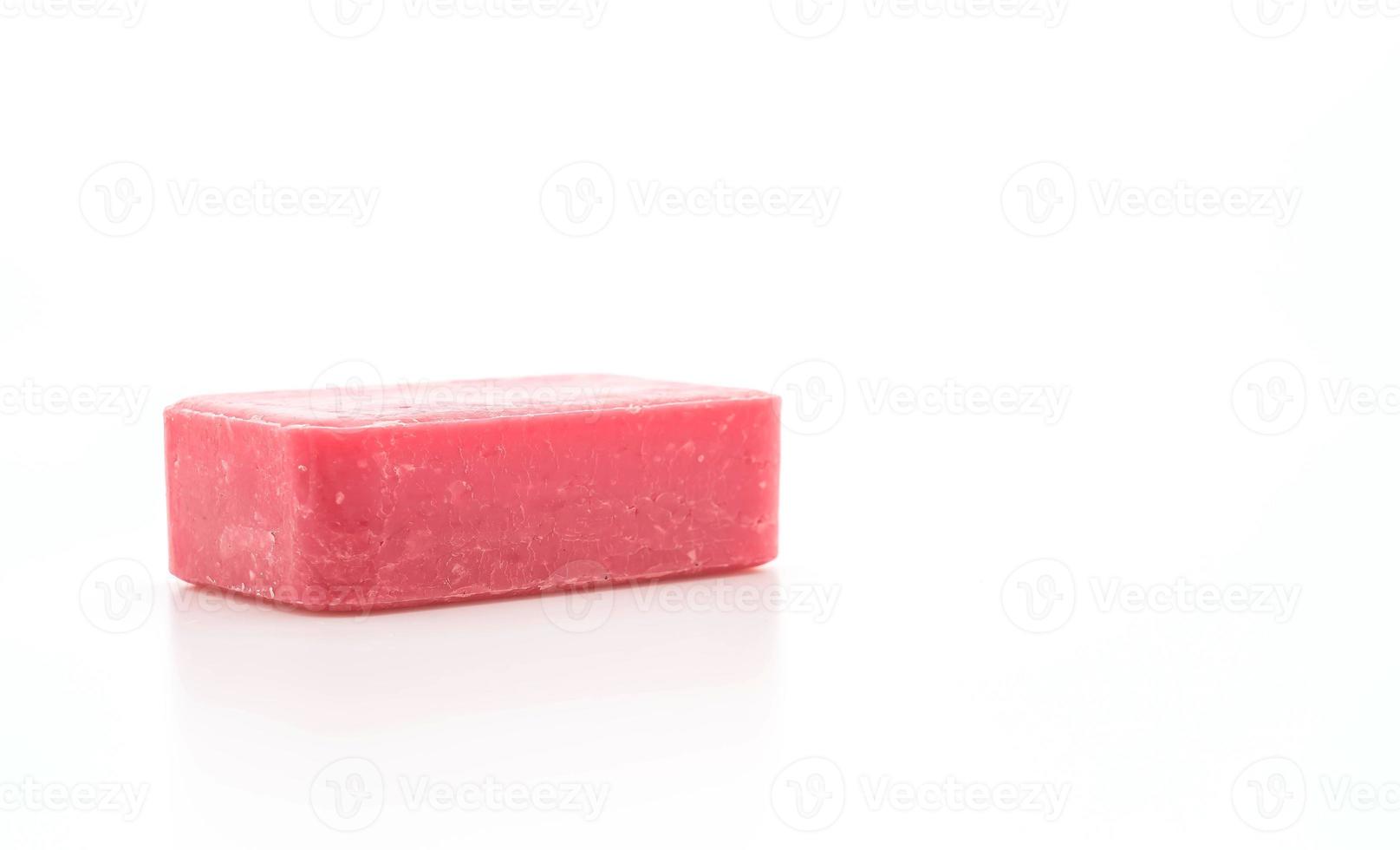 Pink soap on white background photo