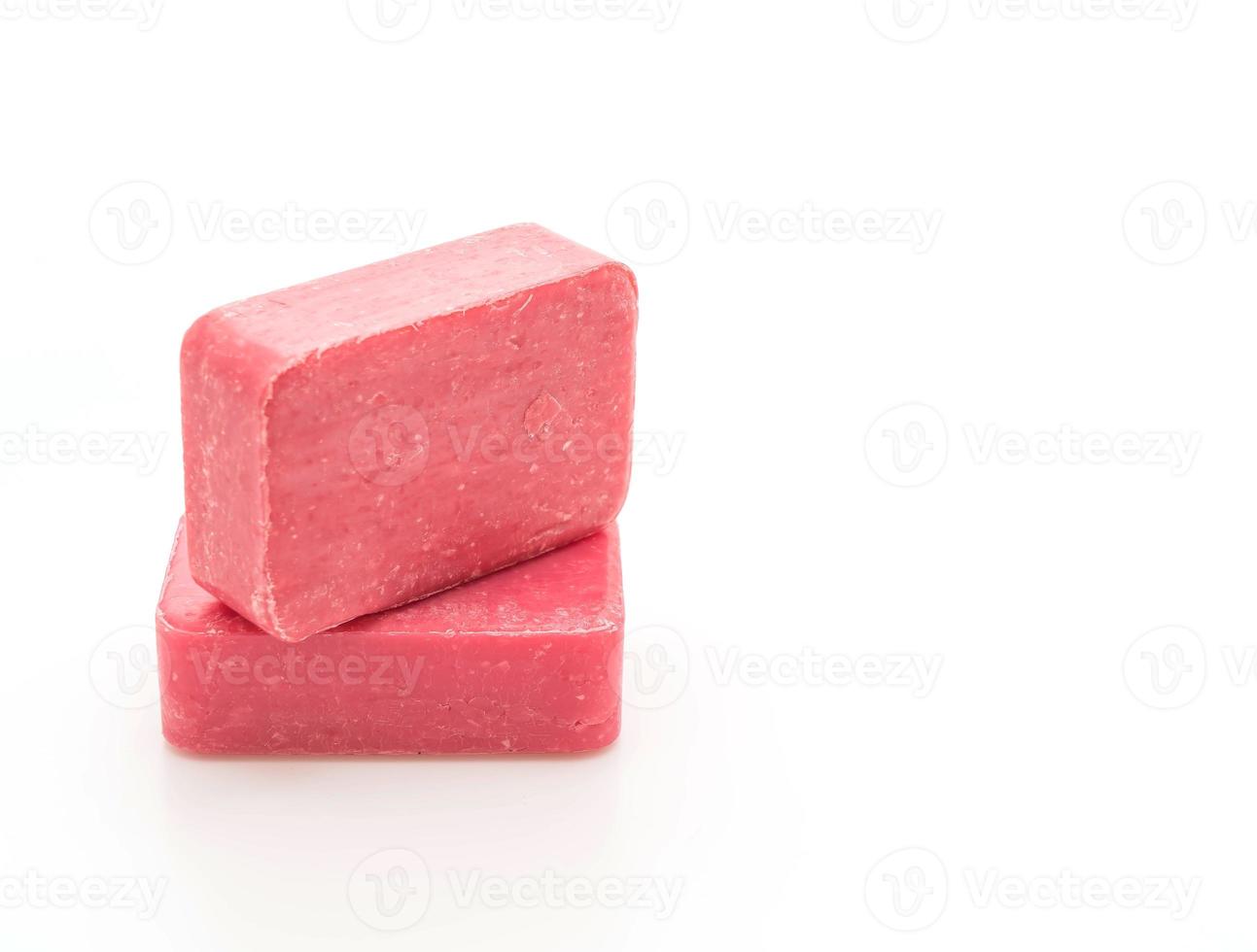 Pink soap on white background photo