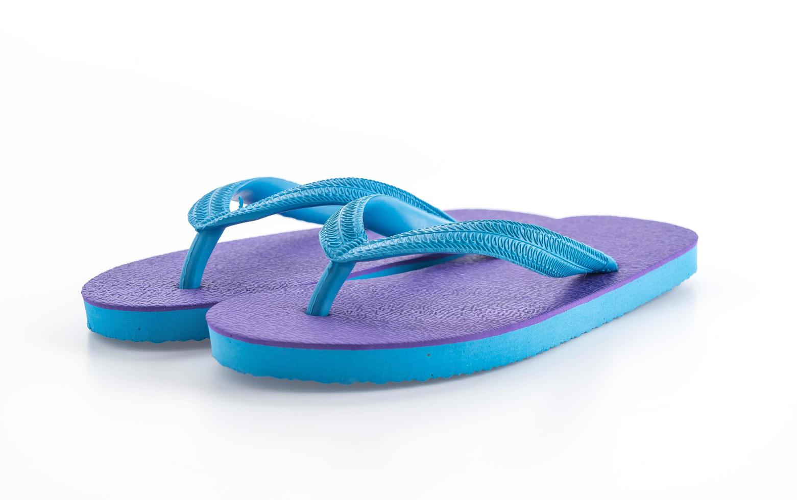 Rubber slippers on white background photo