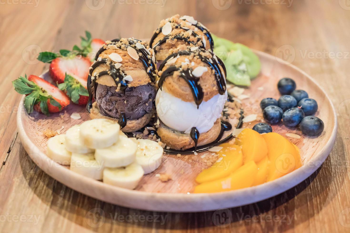 Ice-cream with mixed fruit - dessert photo