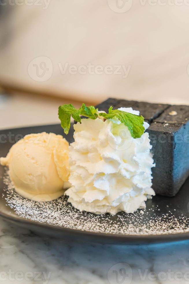 Charcoal toast with ice cream and whip cream photo