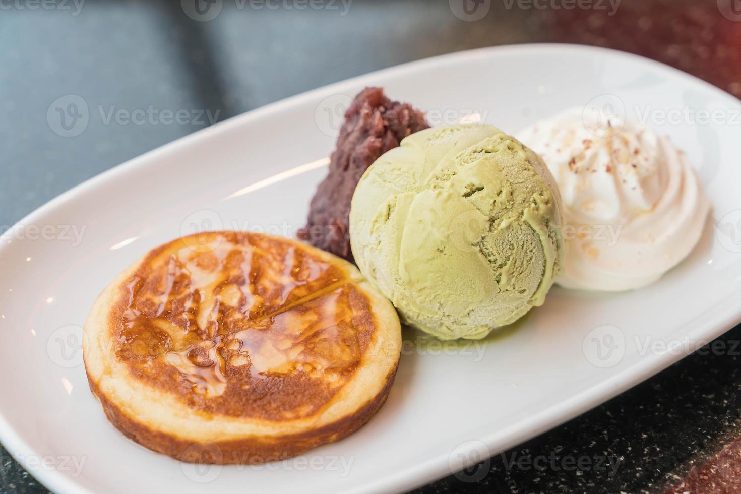 Green tea ice cream with pancake, red bean, and whipping cream - dessert photo