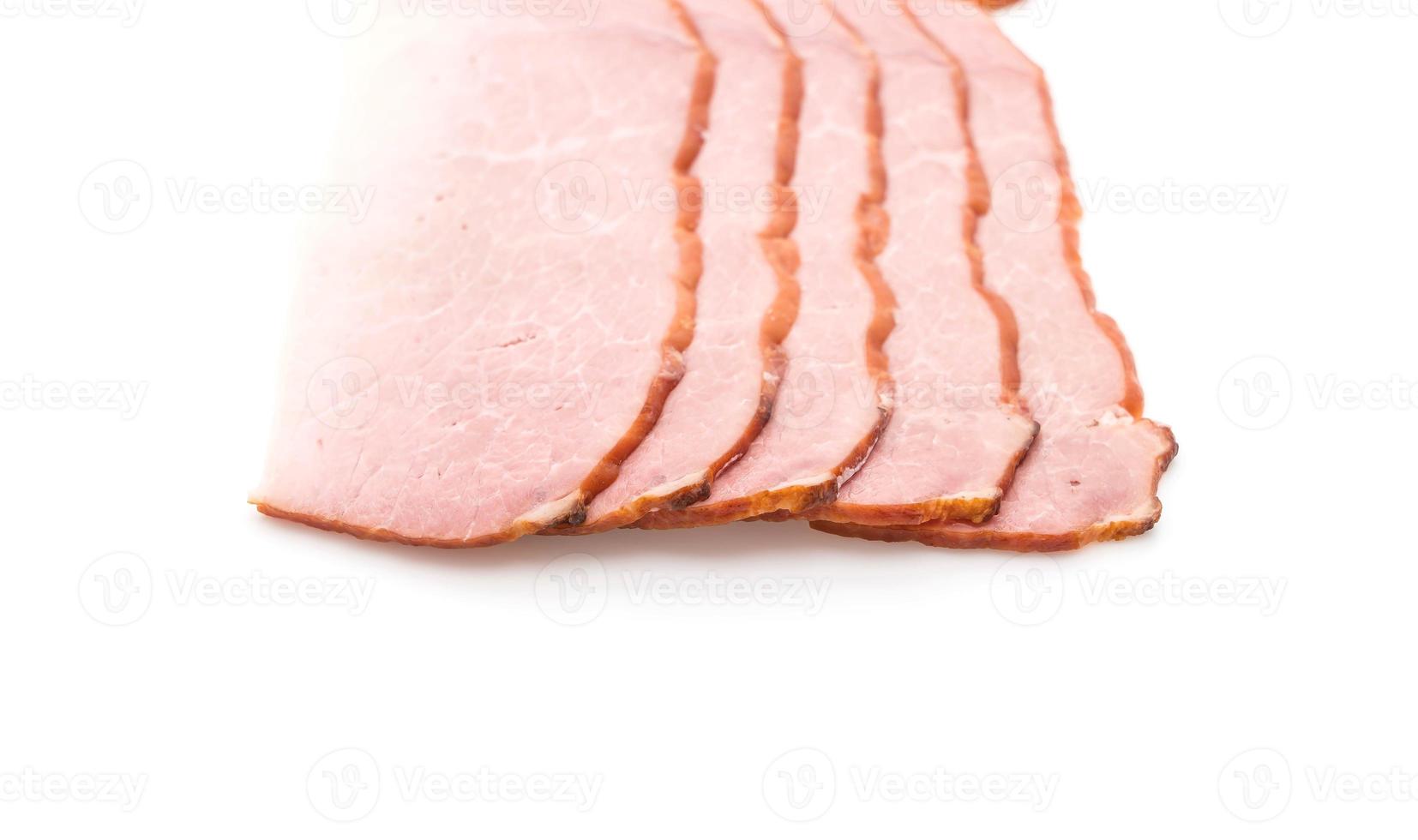 Sliced ham on white background photo