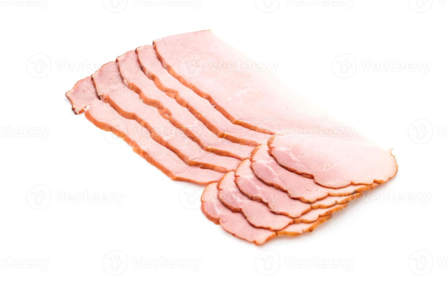 Sliced ham on white background photo