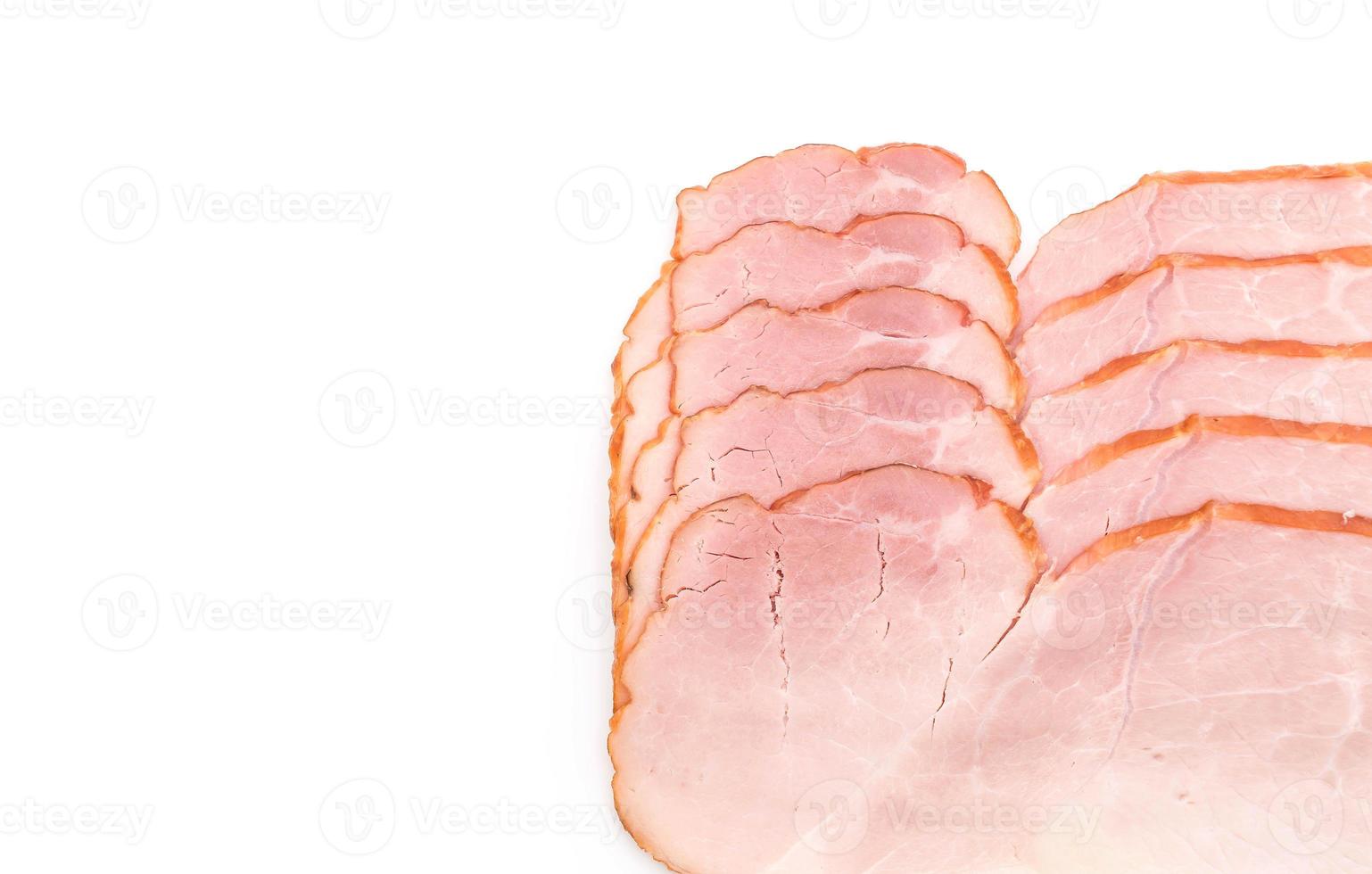 Sliced ham on white background photo