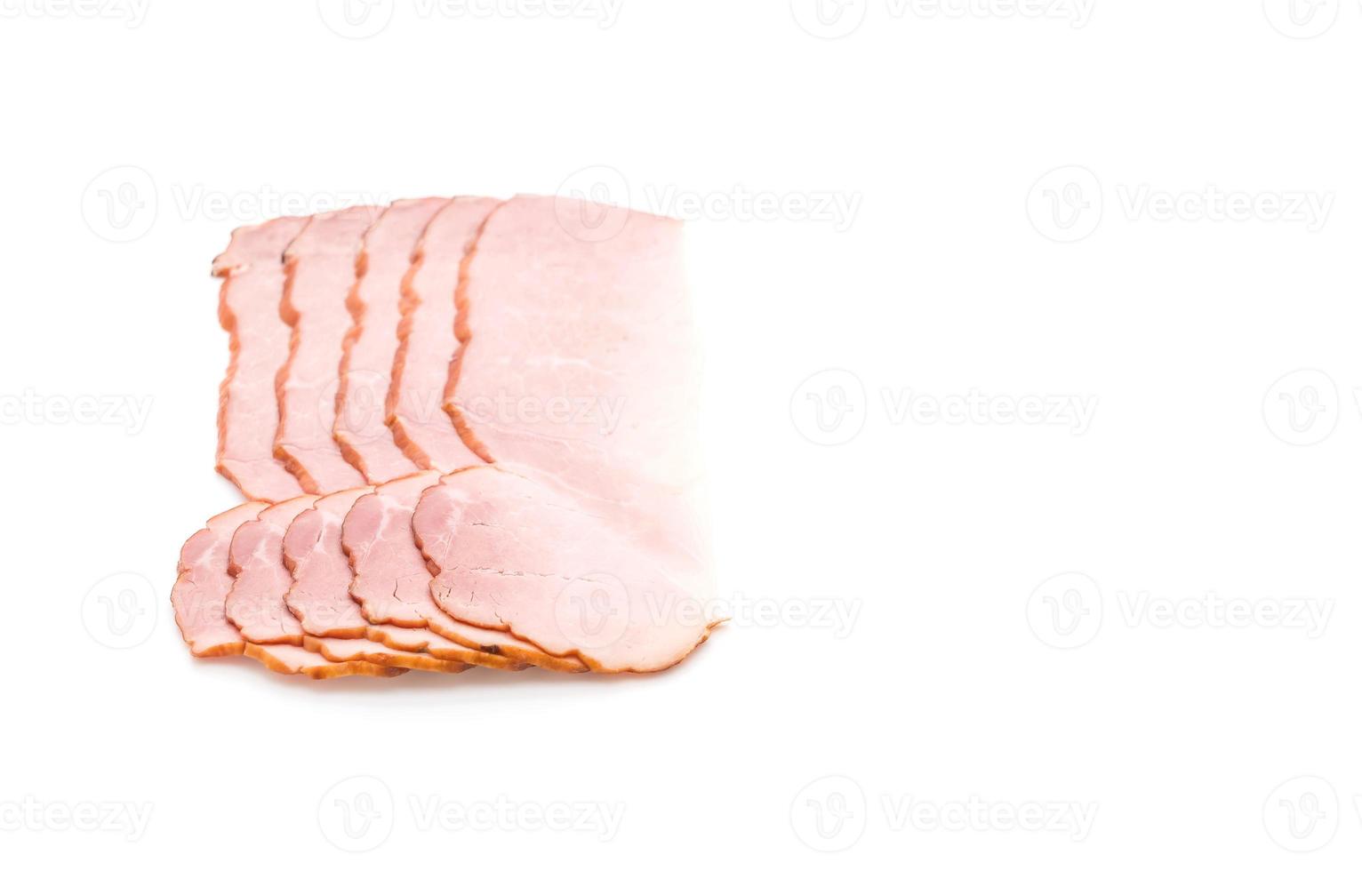 Sliced ham on white background photo