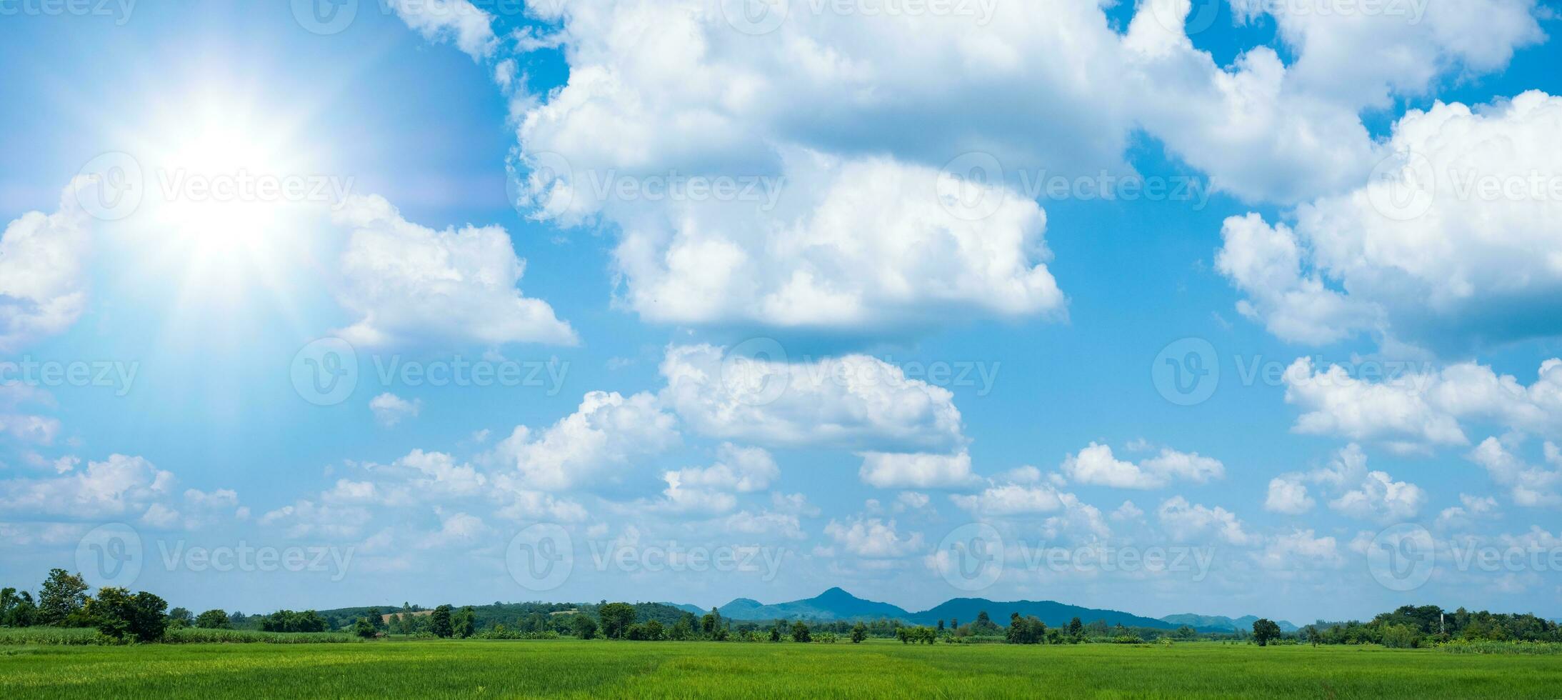 Beautiful blue sky with white clouds and sun photo