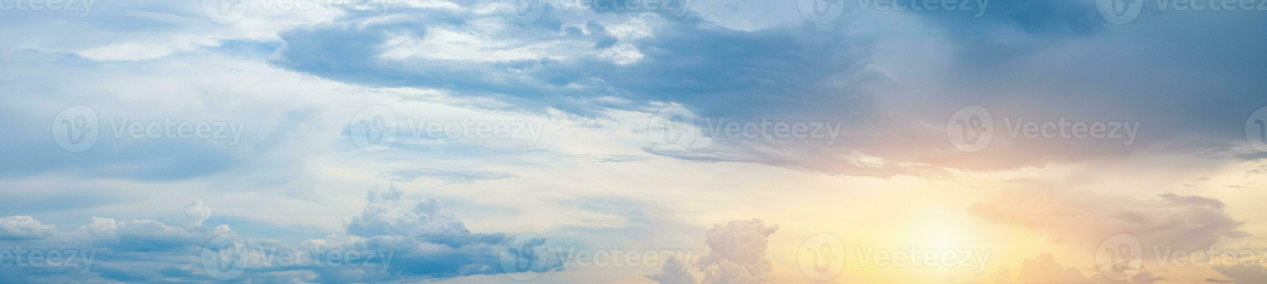 Beautiful blue sky with white clouds and sun photo