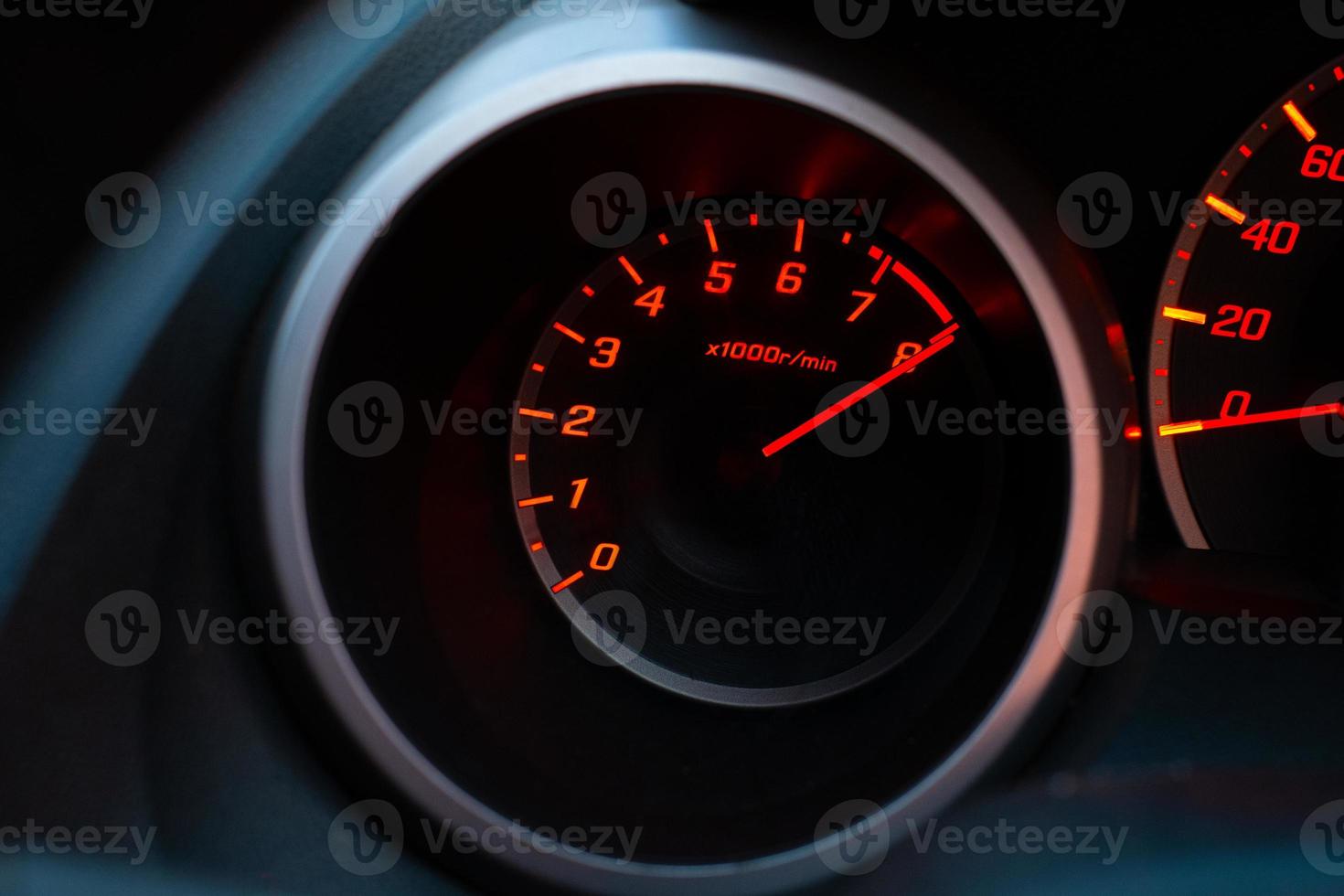 Close up of car speedometer with the needle pointing at  8 krpm photo