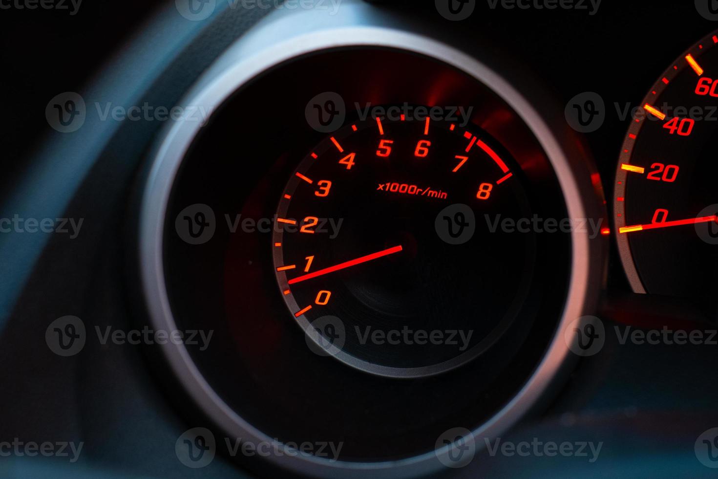 Close up of car speedometer with the needle pointing at  1 krpm photo
