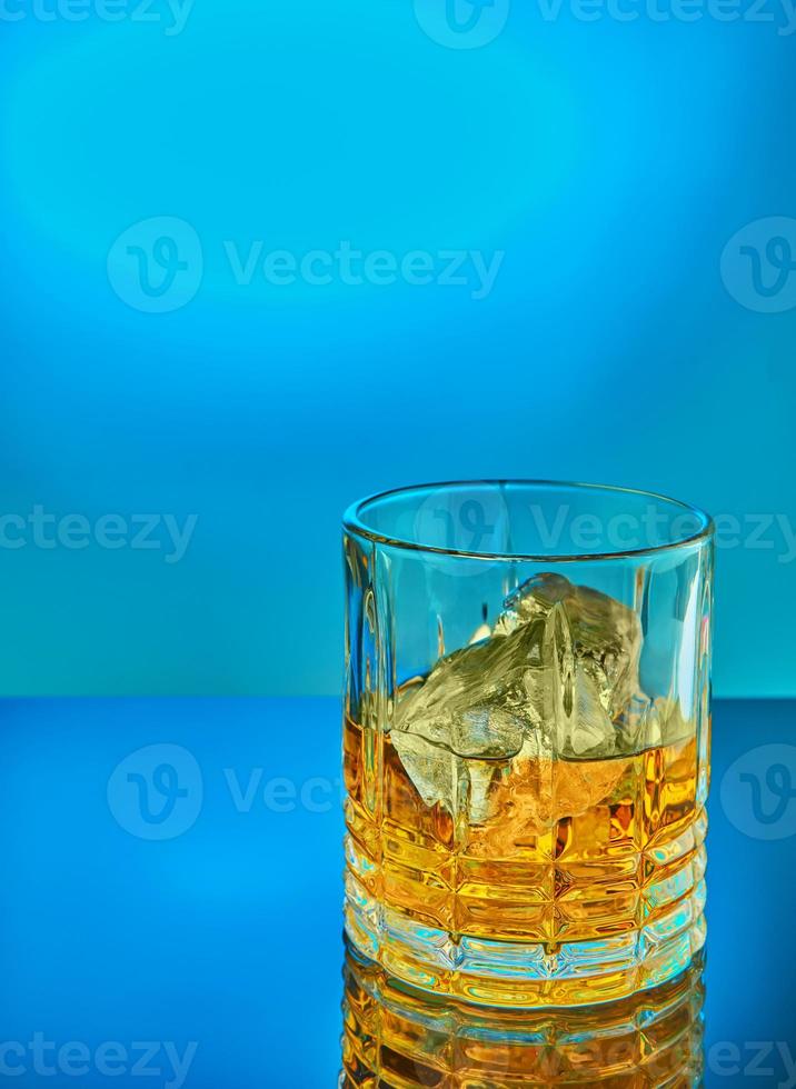 Crystal round glass of scotch whiskey or brandy photo