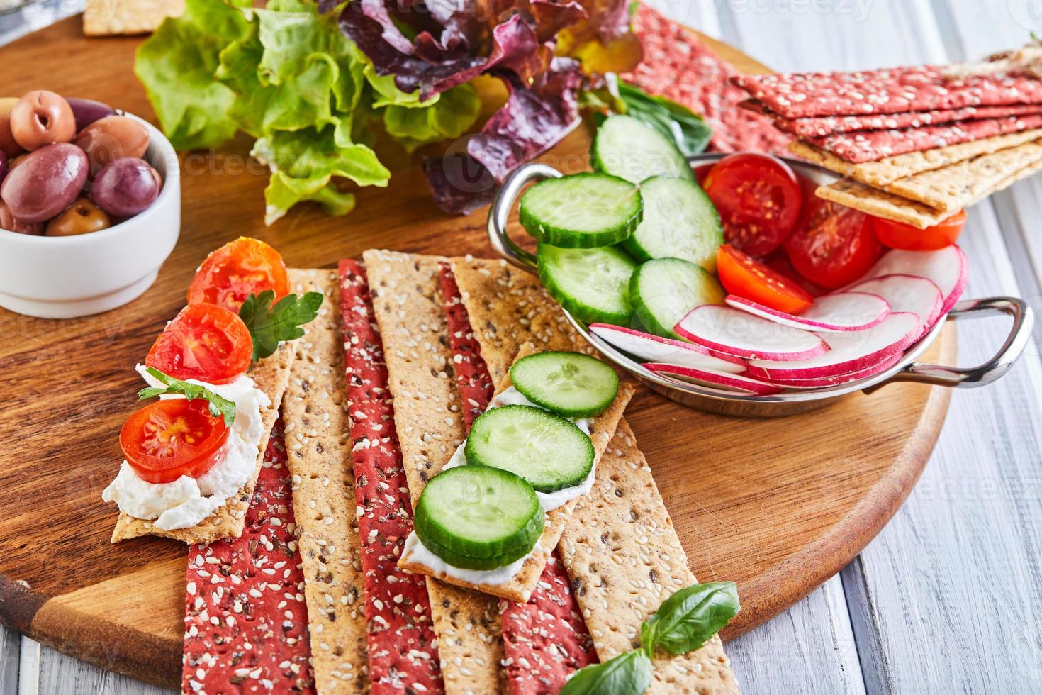 Beetroot and rye flour crackers with vegetable photo