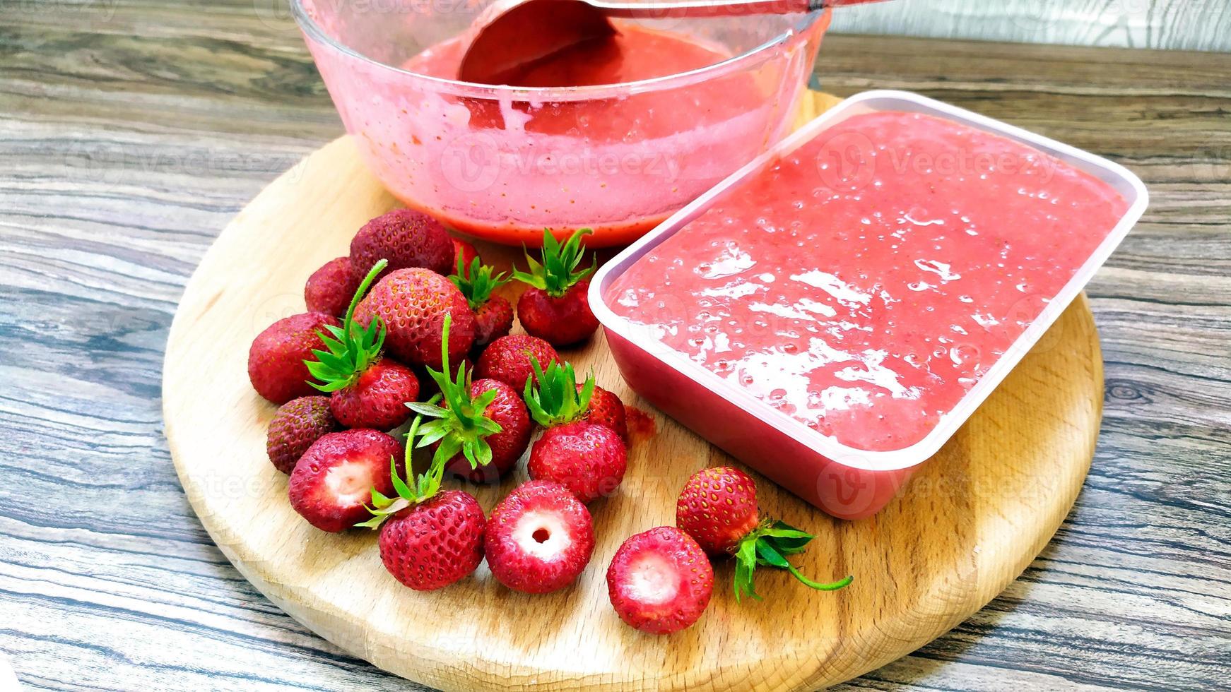 Whole strawberries lie on a cutting board. Harvesting berries. photo