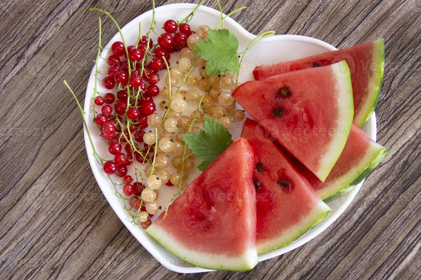 Watermelon and currant berries close-up. photo