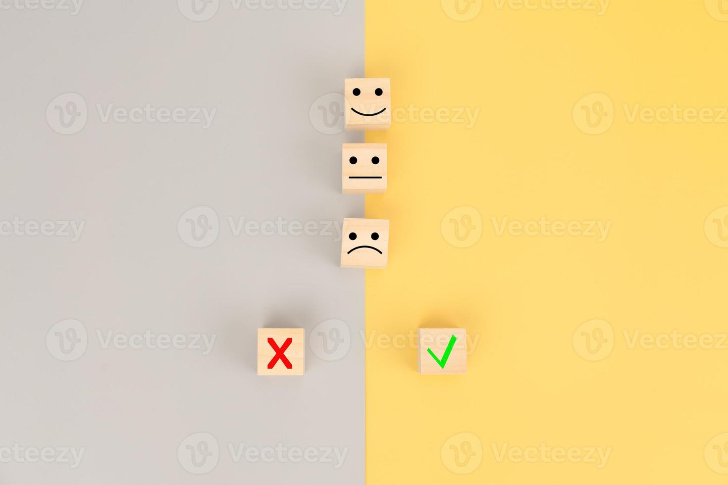 Emotion symbol with false and correct symbol on cube wooden block photo