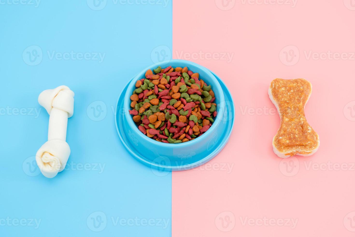 Pet food with snack bone for dog or cat on color background photo