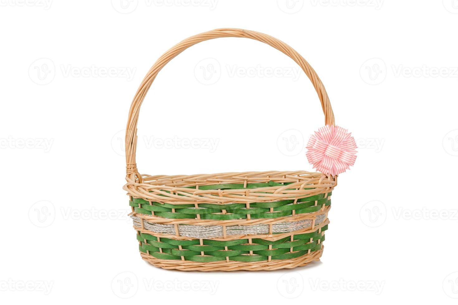 Empty wicker basket with ribbon isolated on white and clipping path photo