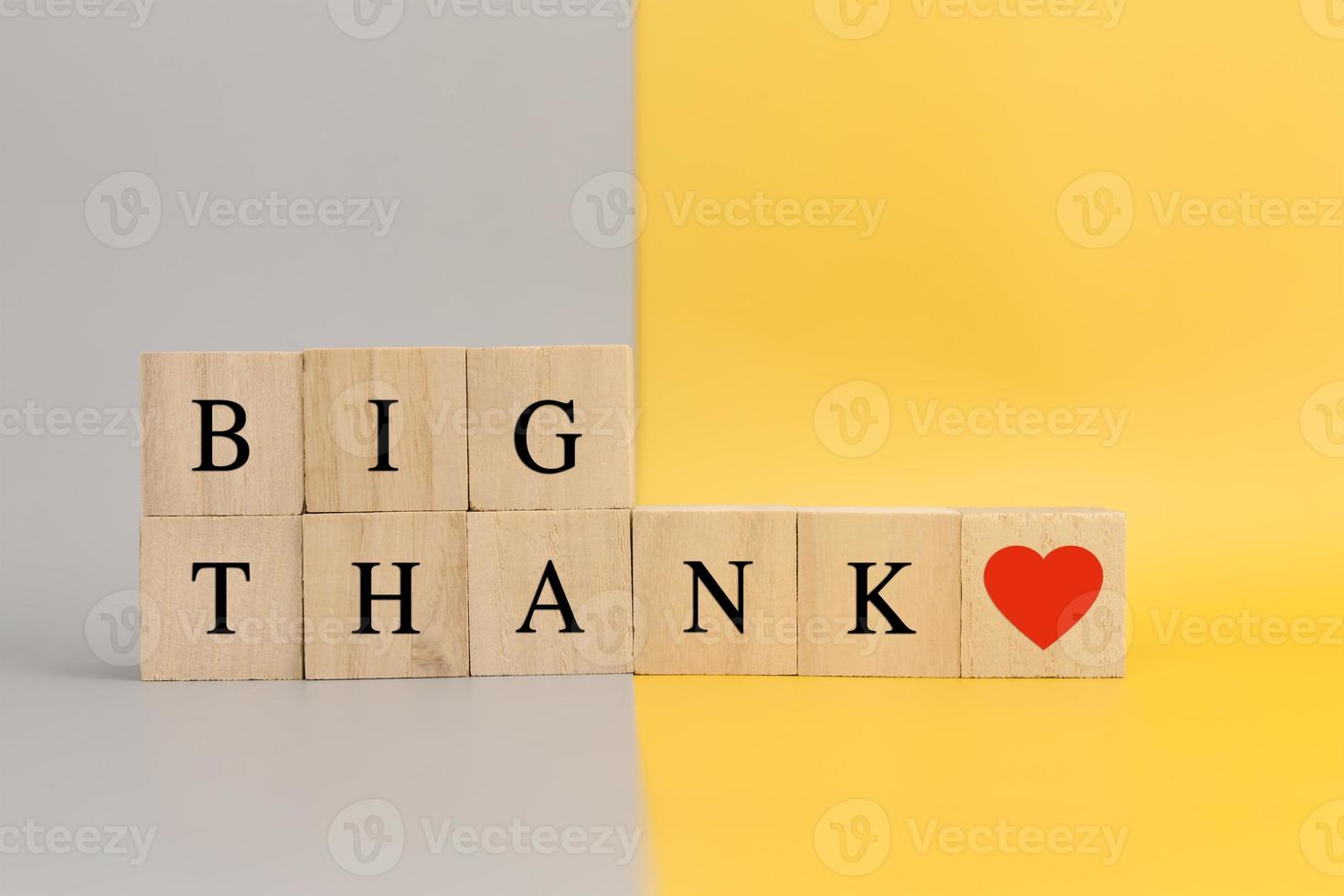 Wooden cube block for Big Thank word and heart symbol photo