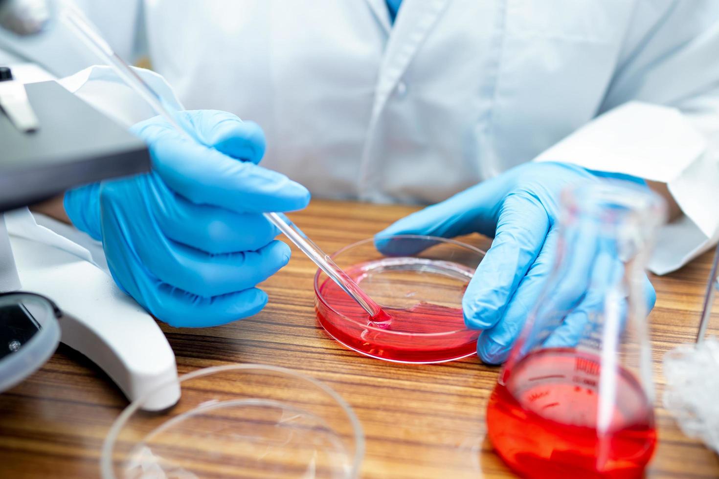 scientist working research with a microscope photo