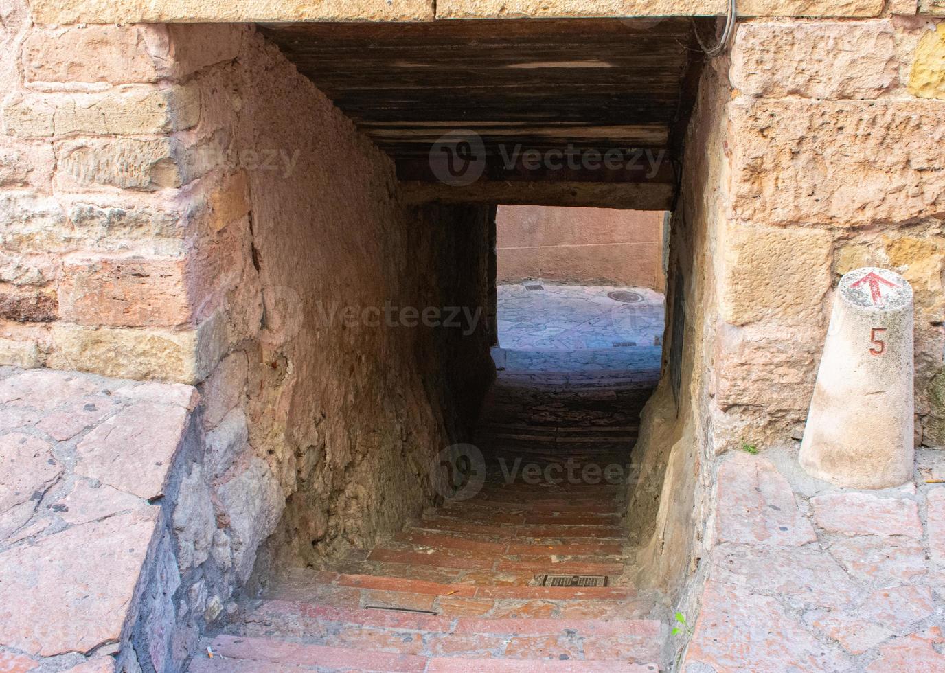 stone passageway in the streets of a medieval city photo