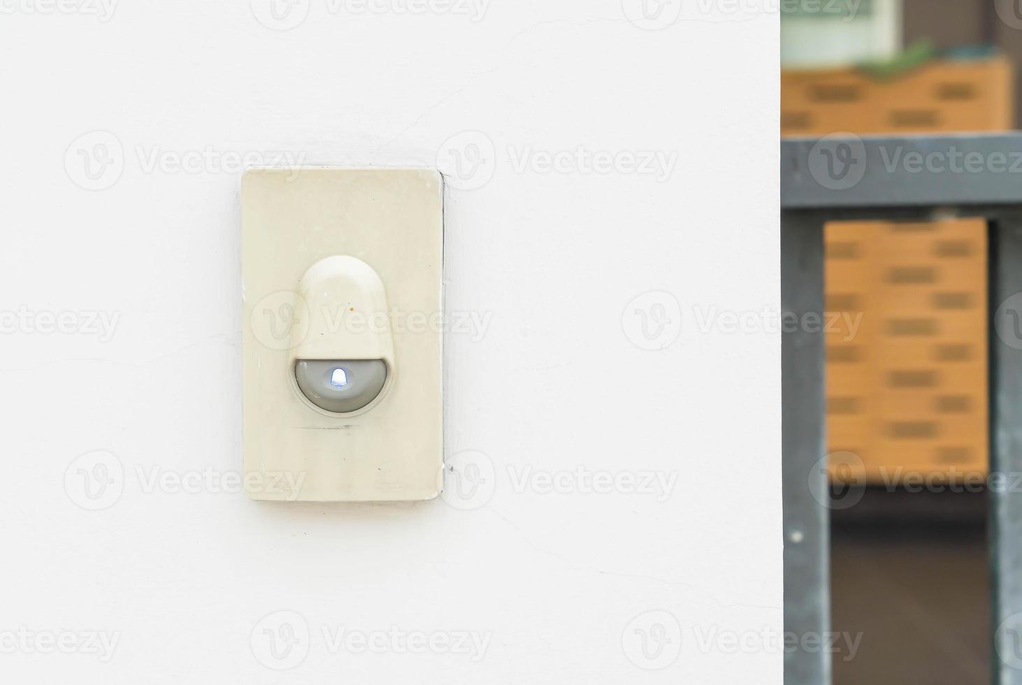 Door bell on wall photo