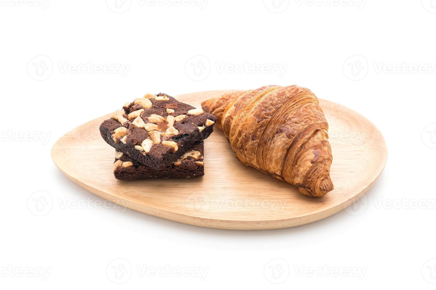 Croissant and brownies on white background photo