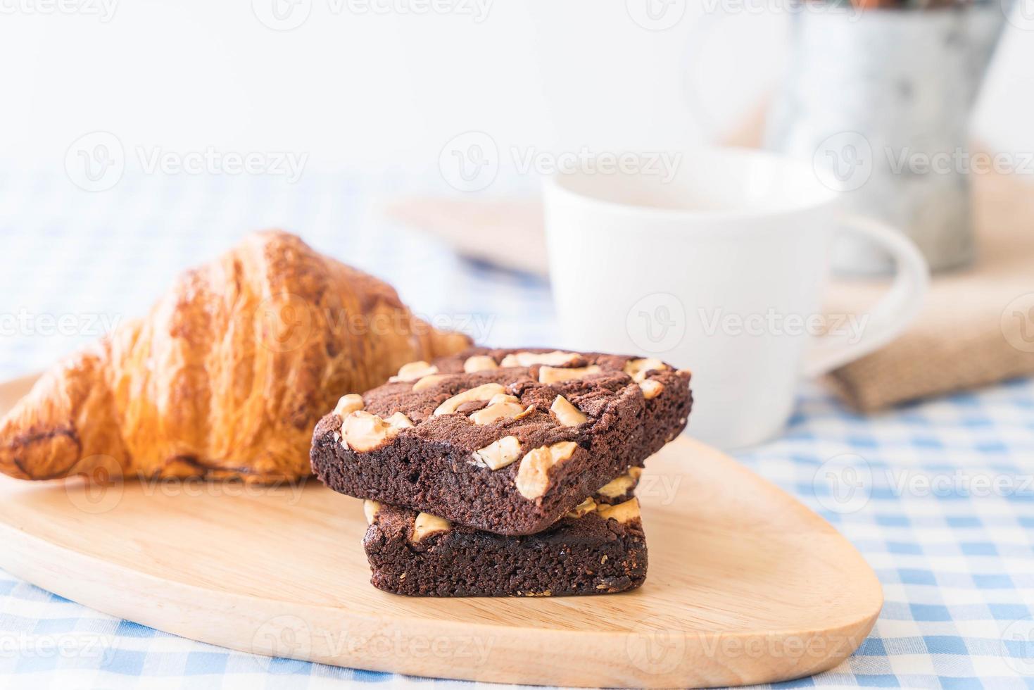 Croissant and brownies on table photo