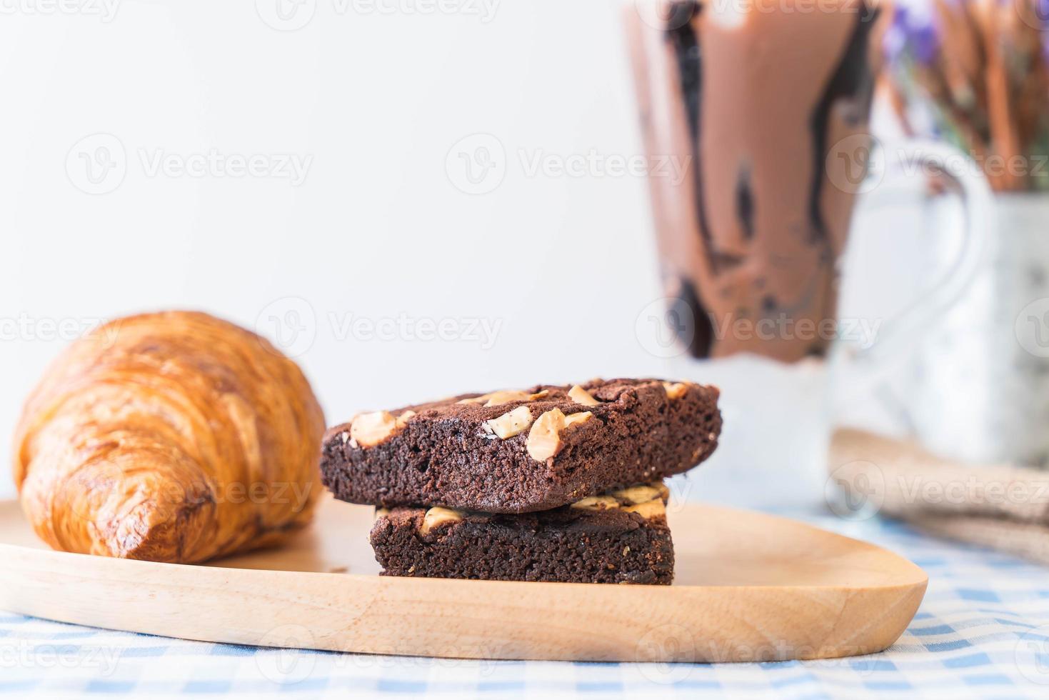 Croissant and brownies on table photo