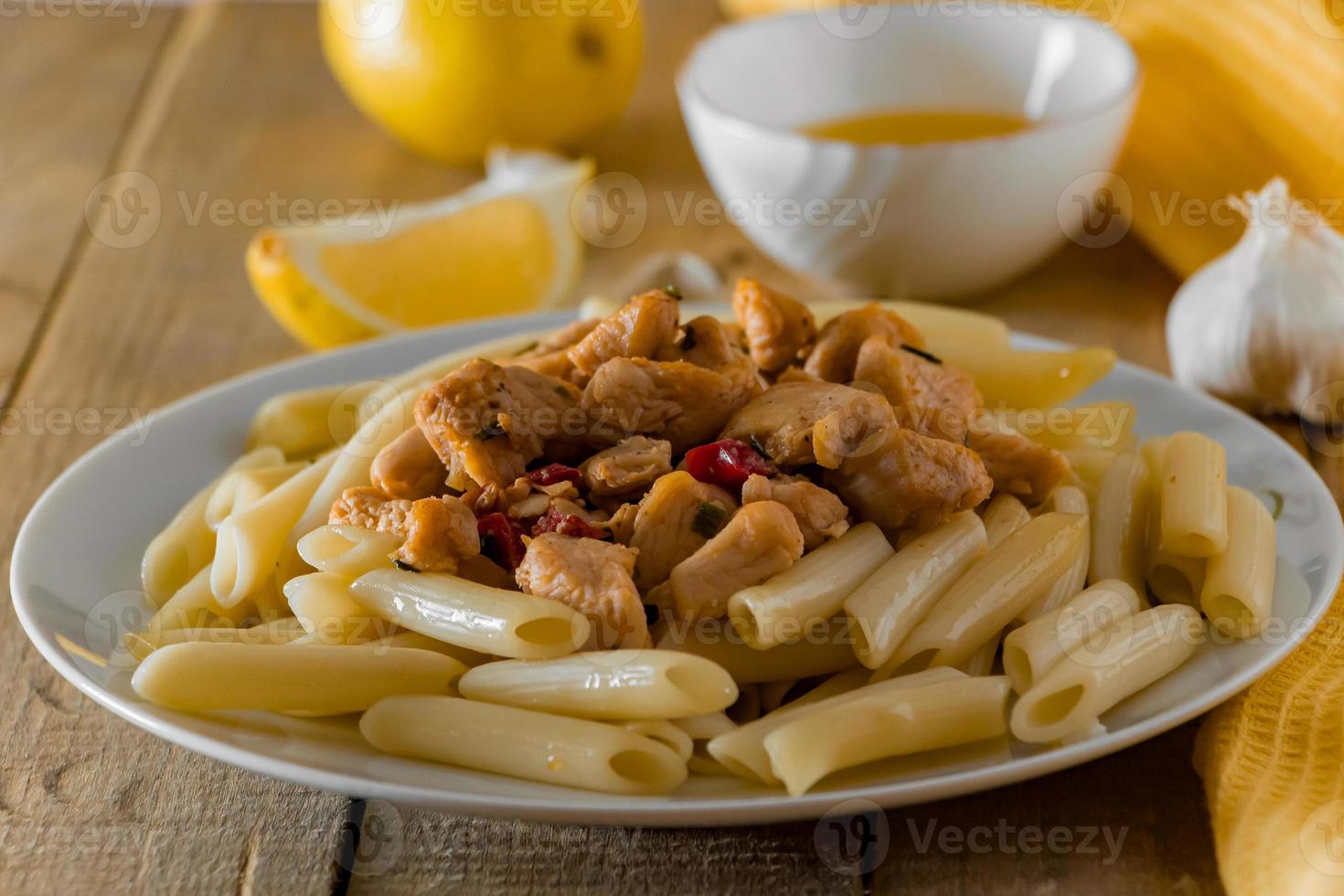 Mediterranean food - penne pasta and chicken in a creamy sauce photo
