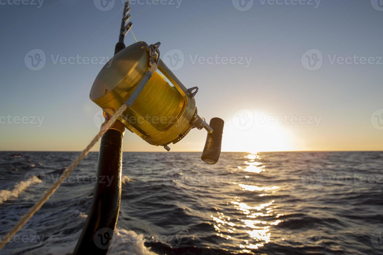 fishing rod on sunset background close up photo