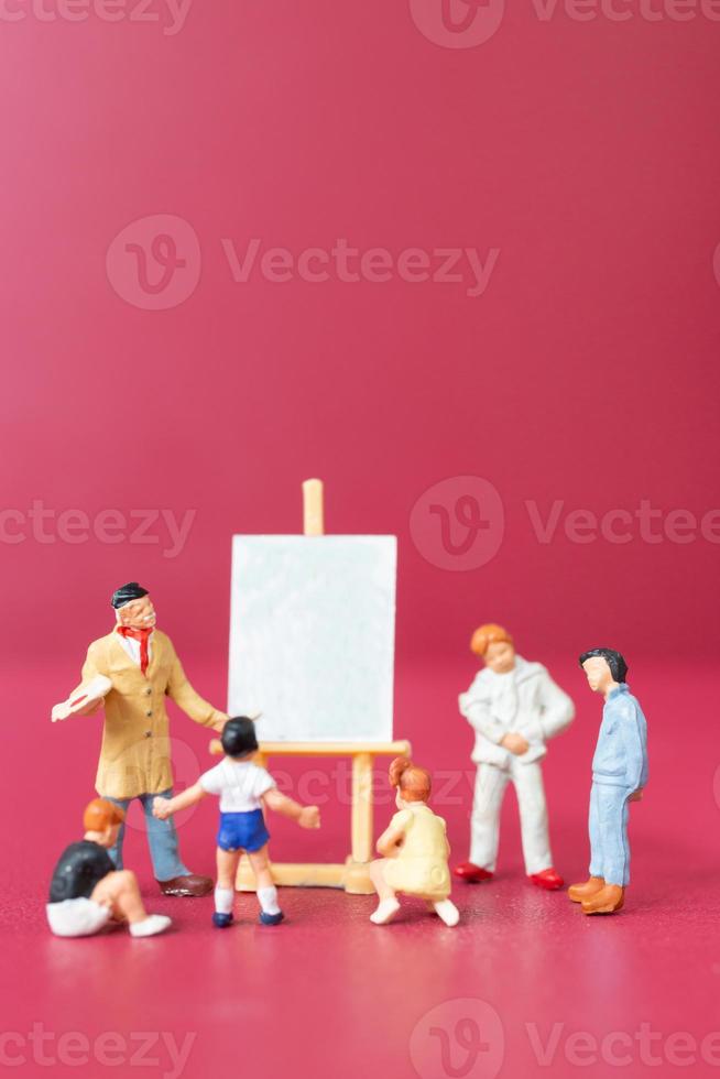 Miniature people art painting class with school children photo