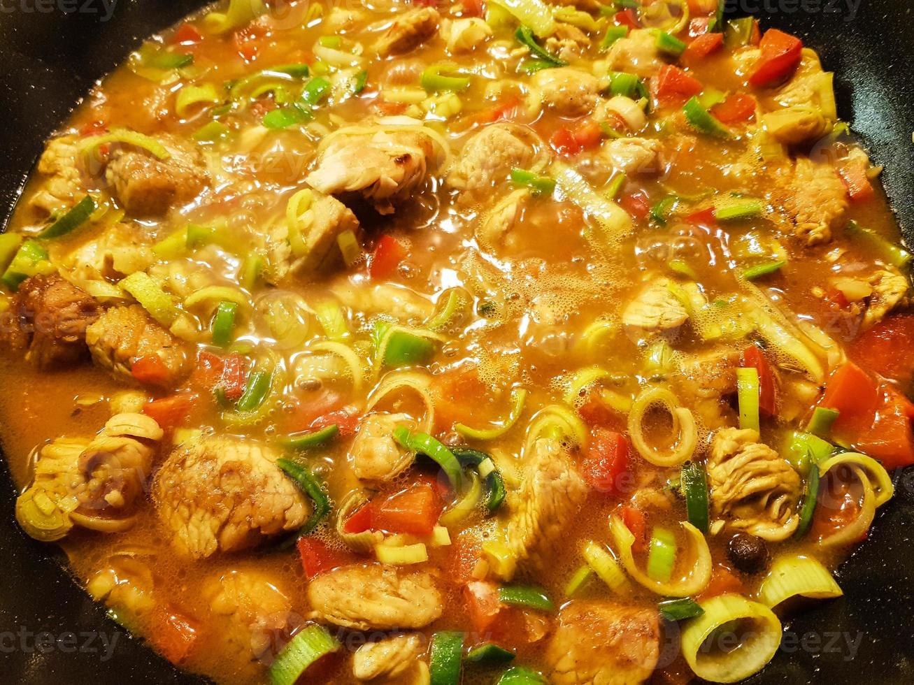 spicy chicken curry with vegetables photo