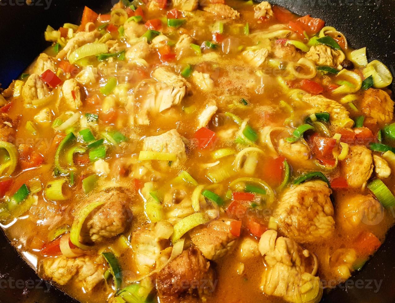 spicy chicken curry with vegetables photo