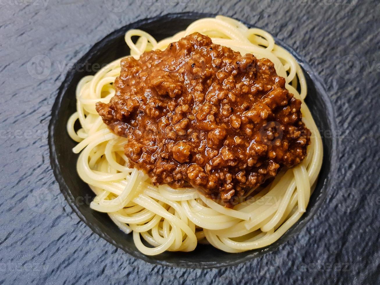 Spaghetti Bolognese with tomato sauce photo