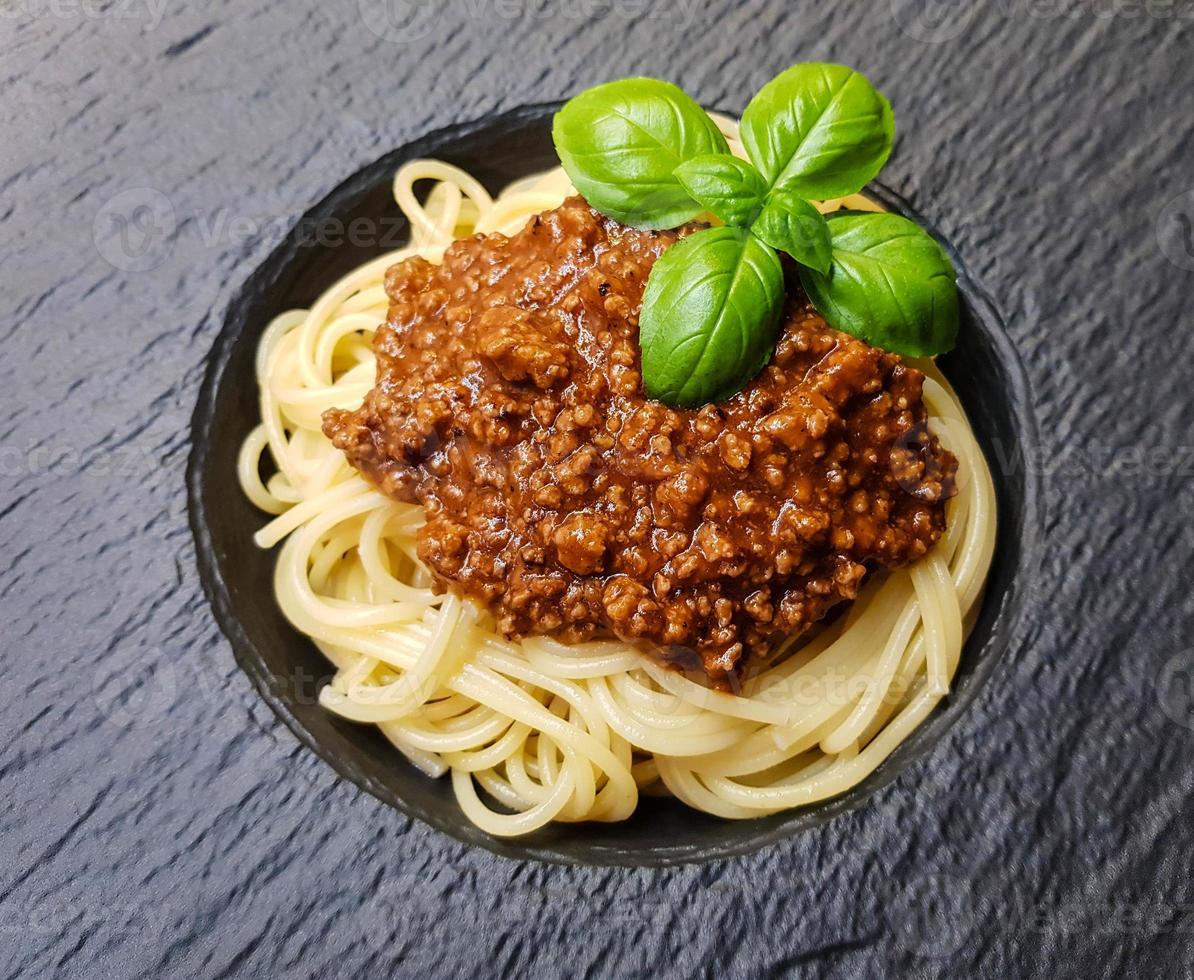 Spaghetti Bolognese with tomato sauce photo