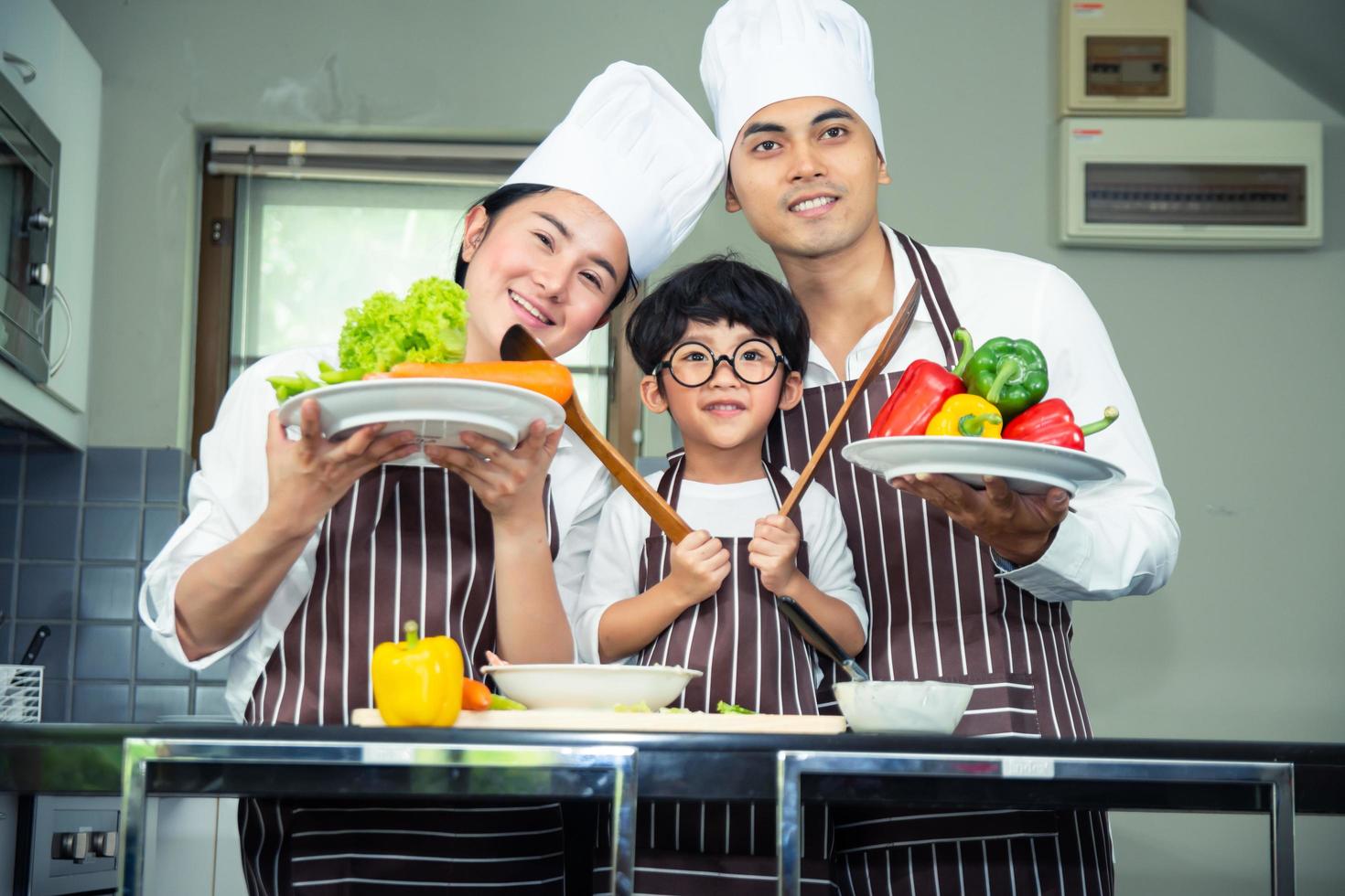 Asian woman young mother with son boy cooking photo