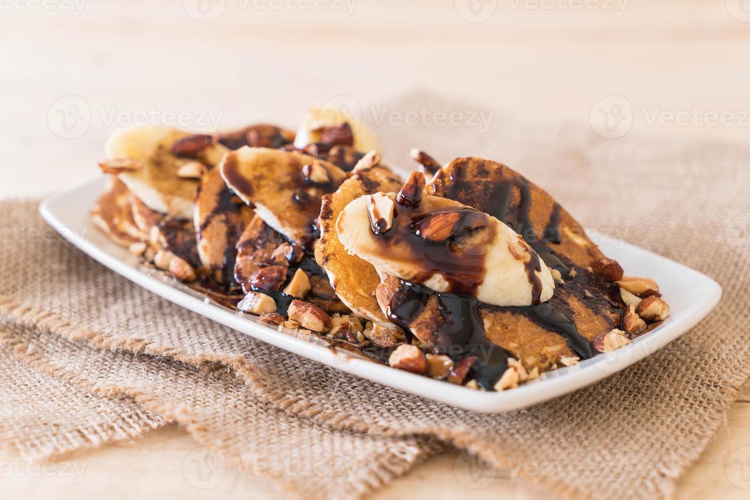 Almond banana pancake with chocolate syrup photo