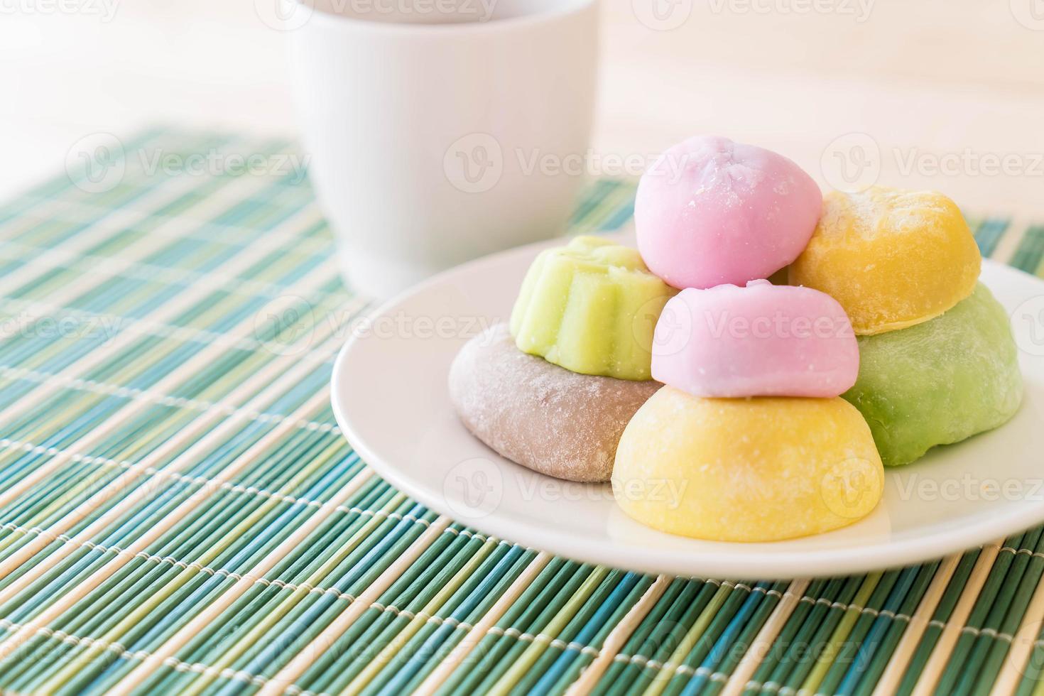 Colorful dessert mochi on white plate photo