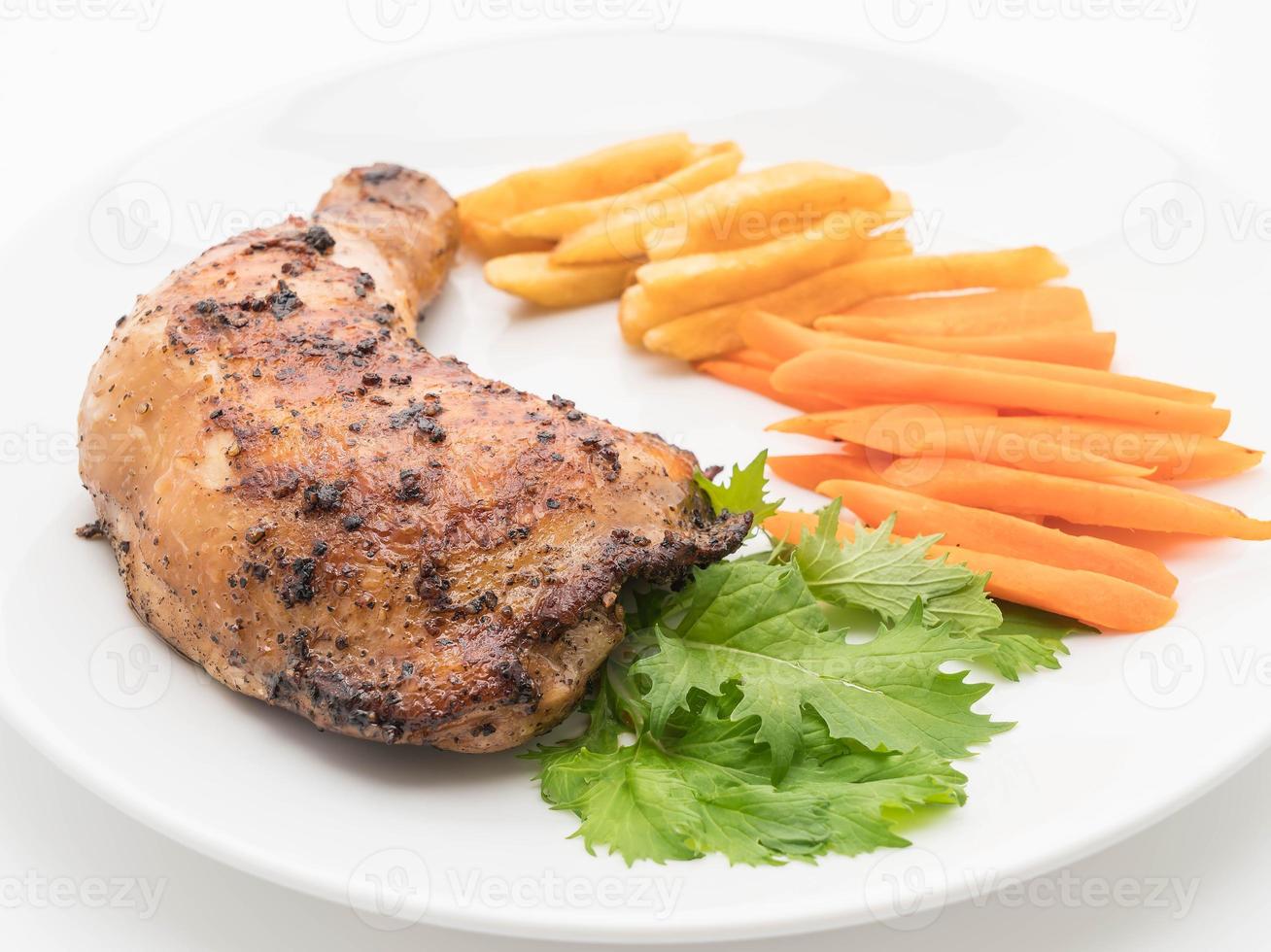 Thigh chicken steak on dining table photo