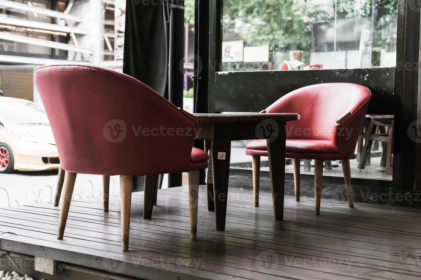 Red chair and table in cafe - vintage effect filter photo