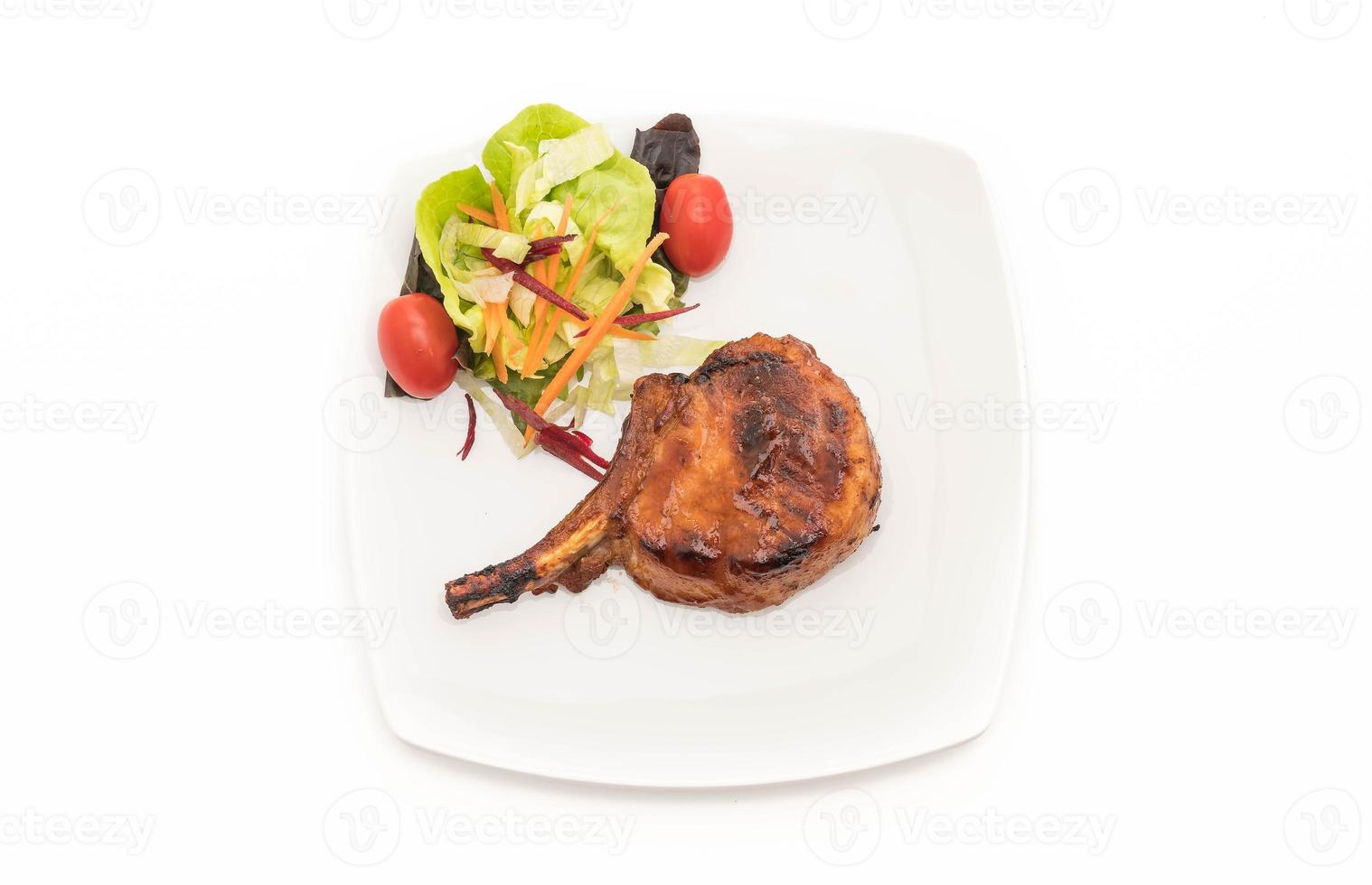 Pork chop steak on white background photo